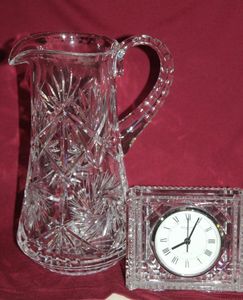 lot 101 image: Antique American Brillian Cut Glass Pitcher with Thumbprint Handle and Fan Hobstar, Waterford clock
