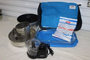 lot 70 image: Pyrex Traveling Glass Pan with Lid, Carry Case and Hotcold Pack, Sifter, Pie Pan and Springform Pan, Personal size Food Processor