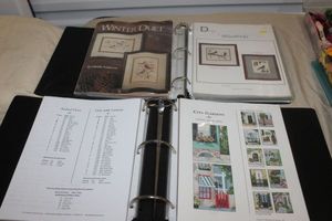 lot 88 image: Two Three Ring Binders full of Cross Stitch Patterns and Instructions alll in Plastic Sheet Protectors