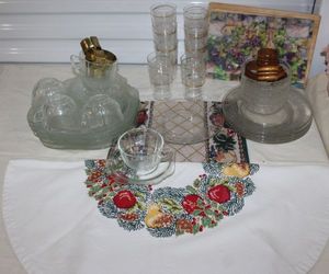 lot 97 image: Cross Stitched Tablecloth, Clear Glass Dishes and other Dcor items Hand towels and Dcor, Ceramic Dcor Items