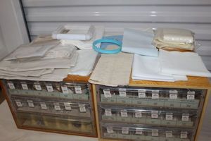 lot 128 image: Two DCM Embroidery Floss Storage and Organization Boxes(Can be used to store and organize many other Items) as well as a generous Quantity of Embroidery Cloth