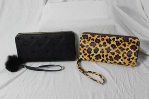 lot 203 image: Two Boutique Wallets, New