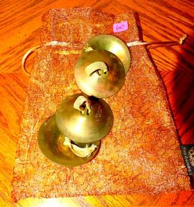 lot 60 image: VINTAGE BRASS FINGER CYMBALS WITH PROTECTIVE STORAGE BAG