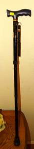 lot 69 image: WALKING CANE - ADUSTABLE HEIGHT WITH COMFORT GRIP AND WRIST STRAP (LIKE NEW)