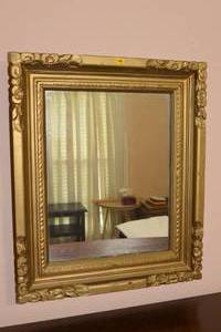 lot 115 image: LARGE DECORATIVE FRAMED MIRROR APPROXIMATELY 2 WIDE $$