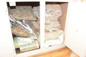 lot 143 image: LINEN CLOSET SHELF LOT - INCLUDES THE CONTENTS OF THE SHELF