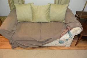 lot 194 image: 2 SEAT SOFA WITH SLIP COVER AND PILLOWS