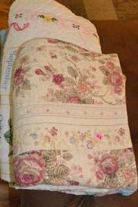 lot 228 image: STACK OF VARIOUS QUILTS