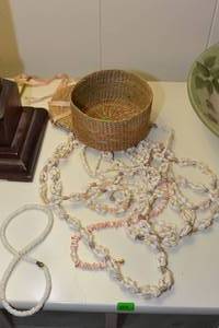 lot 251 image: WICKER JEWELRY BASKET  SEVERAL DIFFERENT SHELL NECKLACES