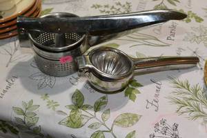 lot 280 image: NICE STAINLESS POTATO RICER AND LEMON  LIME JUICER $
