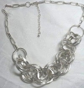 lot 201 image: Signed J Crew modernist interlocked textured ring paper clip link necklace. Has J Crew hang tag. 16L with 3 extender.