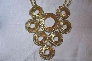 lot 34 image: Concave filigree spike discs gold tone statement modernist pendant necklace with double chain. Lobster clasp. 16L with 3 extender.