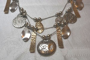 lot 50 image: Modernist layered dangle necklace with convex hammered disc pendant, gold hammered bar dangles and more. 16L with 2 extender. Lobster clasp.