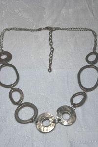 lot 51 image: Modernist flat round and oval hammered disc station necklace. 16L with 3 extender. Lobster clasp.