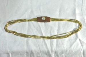 lot 199 image: Industrial gold finish multi chain necklace with surged (sewn) leather and hammered brass button snap. 8L