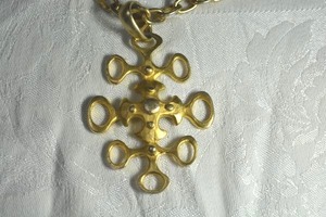 lot 61 image: Unusual Brutalist French quatrefoil style gold tone textured abstract cross pendant on textured chain necklace. 32L and cross is 3.5L. Lobster oversized clasp. Unique piece
