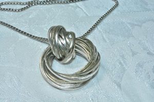 lot 70 image: Modernist multi link coupled link pendant on a 22L ball bead chain necklace. Pendant has polished and textured links. Lobster clasp.