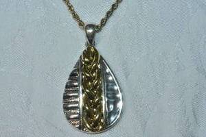 lot 73 image: Tow-tone gold and silver modernist tear drop hammered pendant with braided design on a rope chain necklace. 14L with 2 extender. Large bale pendant is 2.25L