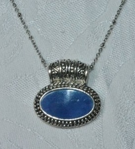 lot 81 image: Modern blue enamel slide oval pendant on a 14L chain. Lobster clasp.