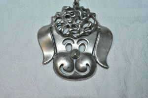 lot 91 image: Modernist MCM exaggerated 1960s 3 dimensional smiling French Poodle dog face pendant on 20L ball bead necklace with 3 extender, large pendant 3.25W x 3H