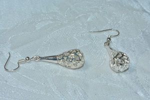 lot 94 image: Bright polished silver tone French ear wire earrings with freeform caged dangles. 2L