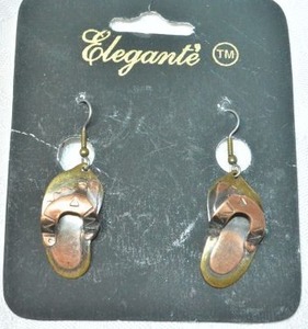 lot 105 image: Signed Elegante brass ear wire earrings in sandal form. Made in India. On branded card and one sandal has Elegante sticker on reverse. 2L