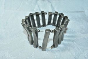 lot 111 image: Heavy industrial vertical bar stretch bracelet with ball separator beads. Needs tightened. 1.75W