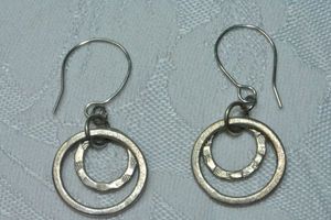 lot 113 image: Industrial open circle disc French ear wire earrings. 1.5L