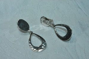 lot 117 image: Highly polished clip modernist earrings with hammered open tear drop dangles. 2L