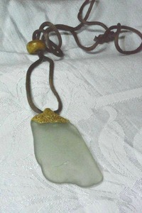 lot 123 image: Vintage beach glass sea shard pendant on fabric corded necklace with wooden adjust bead. 30L