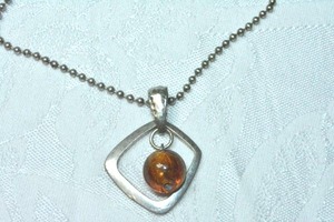 lot 124 image: Hammered dangle pendant with faux Amber glass bead on 18L ball bead necklace. Pendant 1.5L