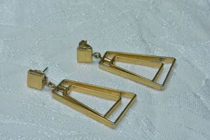 lot 165 image: Signed Avon gold tone modernist double pyramid shape poststud earrings. 1.75L