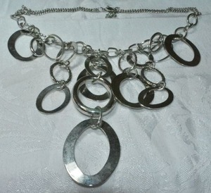 lot 170 image: Modernist polished and textured oval bib necklace with double chain yoke. Lobster clasp. 18L with 3 extender.