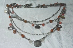 lot 171 image: Modernist multi strand necklace with shell discs, hammered discs and beads. Lobster clasp. 26L