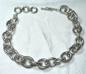 lot 172 image: Heavy modernist polished steel large link 16L necklace with toggle clasp and single black rhinestone decorated focal link.
