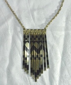 lot 178 image: Modernist hanging spike pendant with printed black chevron motif. 30L with 2 extender. Lobster clasp. Drop 3.5L