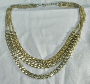 lot 179 image: Gold finish industrial Cuban chain link necklace with micro link chain yoke. Lobster clasp.