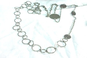 lot 180 image: Signed modernist circle link opera length disc necklace with hammered disc station. Lobster clasp. Has Park Lane hang tag. 50L