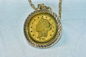 lot 225 image: Gold finish replica 1776 bicentennial (1776-1976) 20 dollar coin pendant on 24L chain. Spring ring clasp.