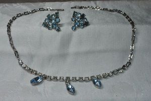 lot 228 image: Vintage silver finish prong set clear and marquise shape blue rhinestone necklace and screw back earrings. Shepherd clasp. 16L