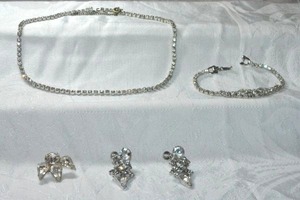lot 237 image: Rhinestone jewelry. Includes 16L necklace with safety chain, 7L bracelet with fold over clasp, clip and screw back dangle earrings. Al prong set.
