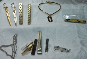lot 244 image: Vintage tie bar assortment. Includes a Catalan or celluloid pocket knife (oxidized).