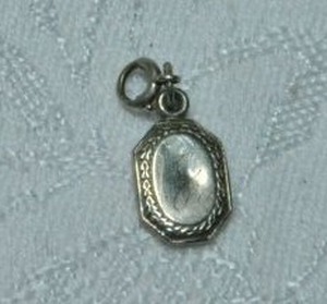 lot 255 image: 10K white gold vintage charm with script J. Marked 10K