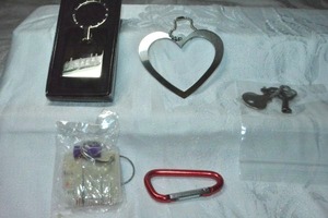 lot 282 image: Keychain selection. Includes a J. Jill (Massachusetts, 1955 - ) branded gift boxed keychain in form of a shopping bag.