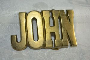 lot 212 image: Solid brass JOHN belt buckle. Marked BRP Solid Brass 839 Taiwan ROC (Republic of China 1945 - present).