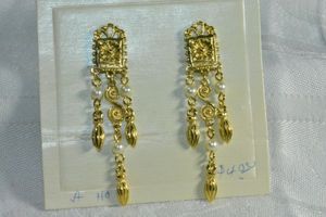 lot 218 image: Figural cuckoo Clock clip earrings in gold finish with faux seed pearls. 2.5L