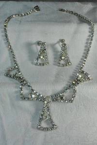lot 204 image: Rhinestone necklace with matching screw back earrings. Earrings match pendant area of necklace. 14L. Earrings 1.25L Fold over clasp.