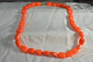 lot 206 image: Signed Crown Trifari neon orange acrylic bead necklace with Crown Trifari T logo hang tag. Spring ring clasp. 22L