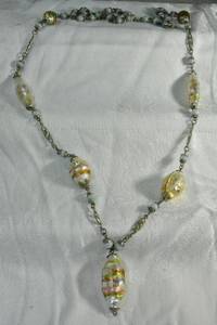 lot 207 image: Vintage MCM or earlier Venetian or Czech foil glass art bead metal chain necklace. Bead caps appear to be poured spelter. 36L Overall 38L. Spring ring clasp.
