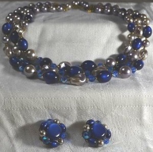lot 214 image: Thermoset dark blue triple strand MCM necklace with matching clip button earrings. 14L